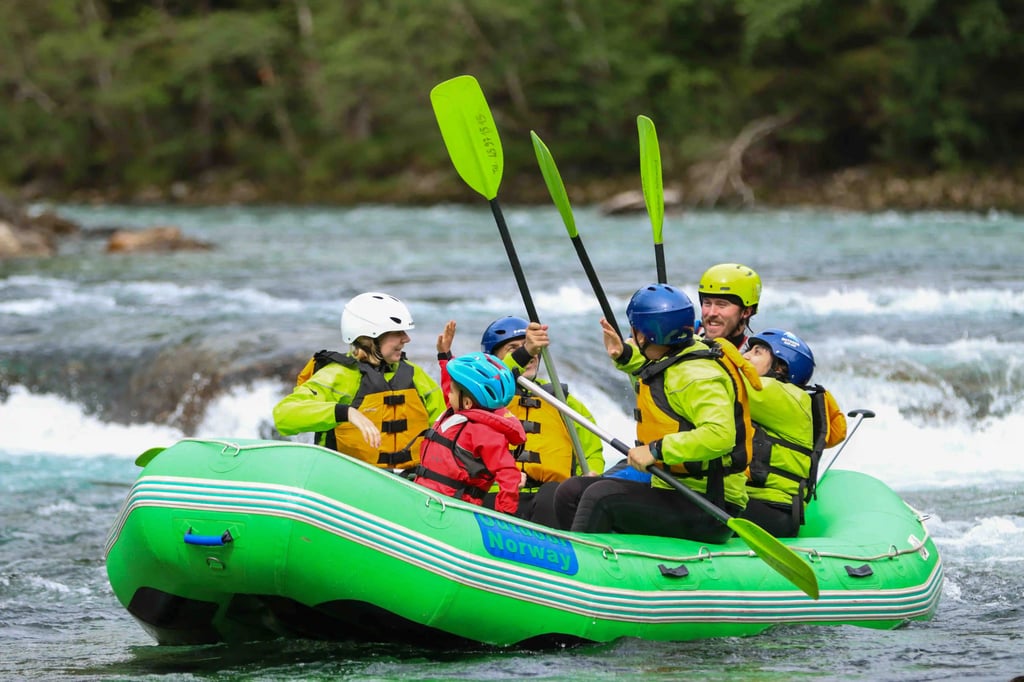 Family rafting adventure on turquoise river amid lush green forest, smiling and paddling.