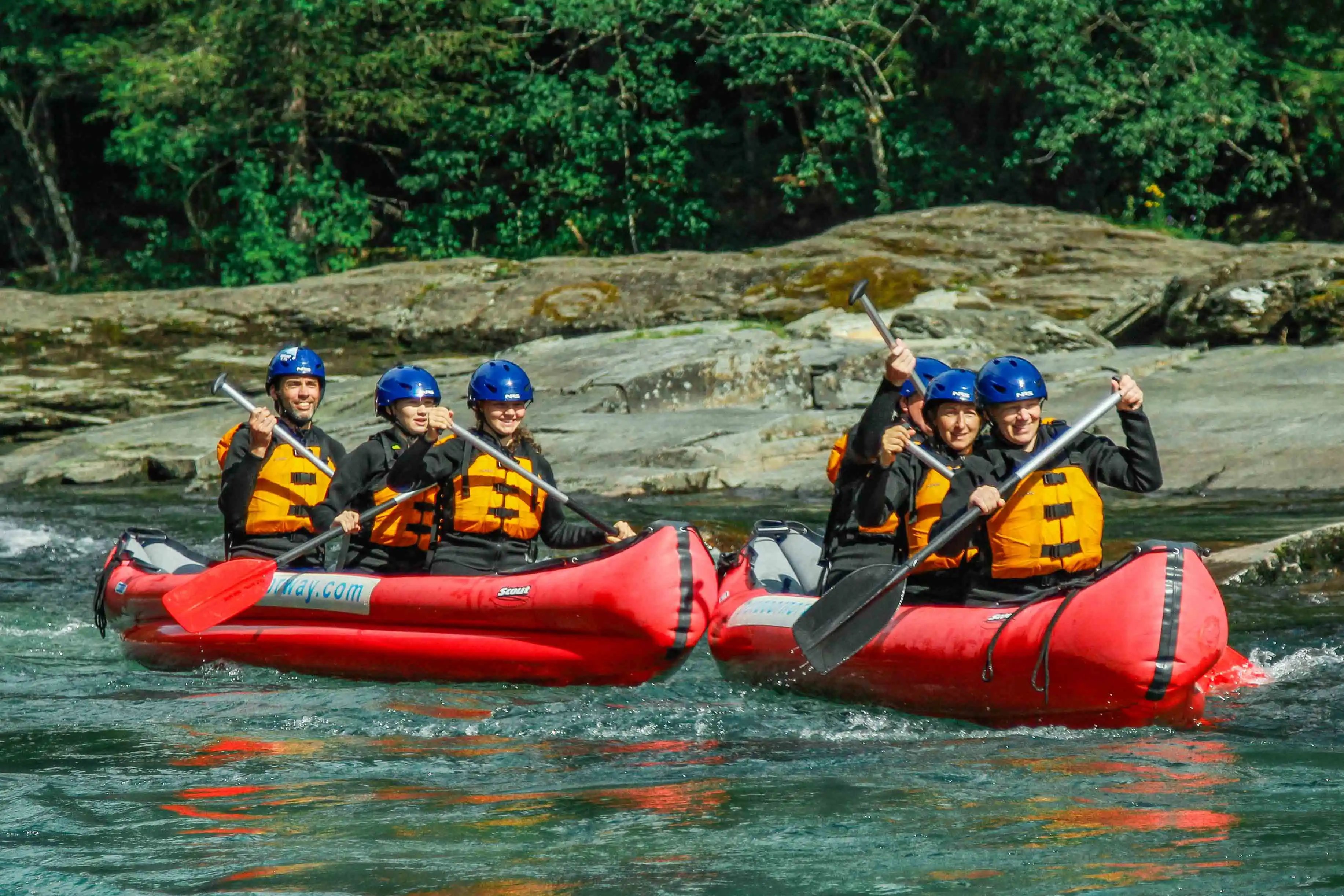 A group on a river canoe tour in Raundal river in Western Norway