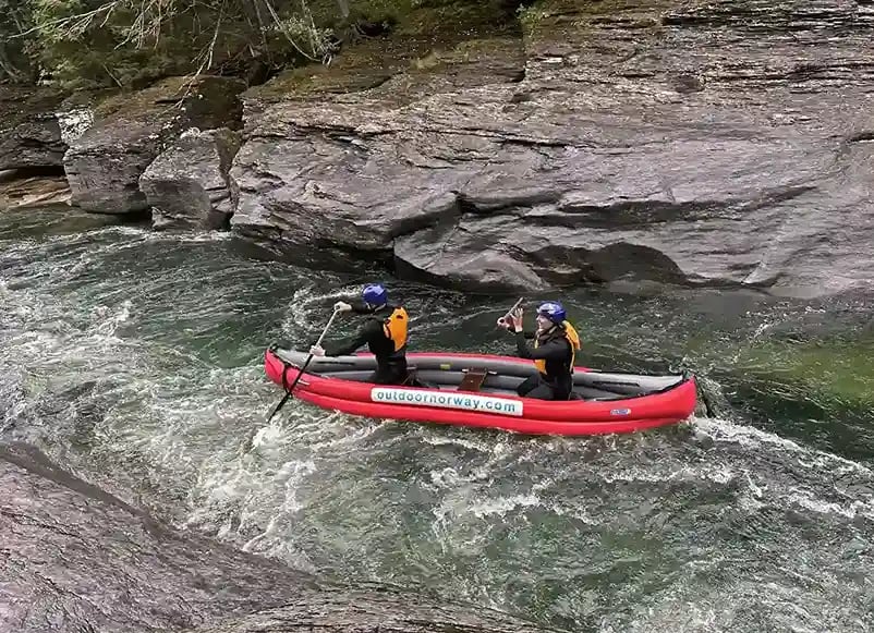 Canoeing through rocky rapids