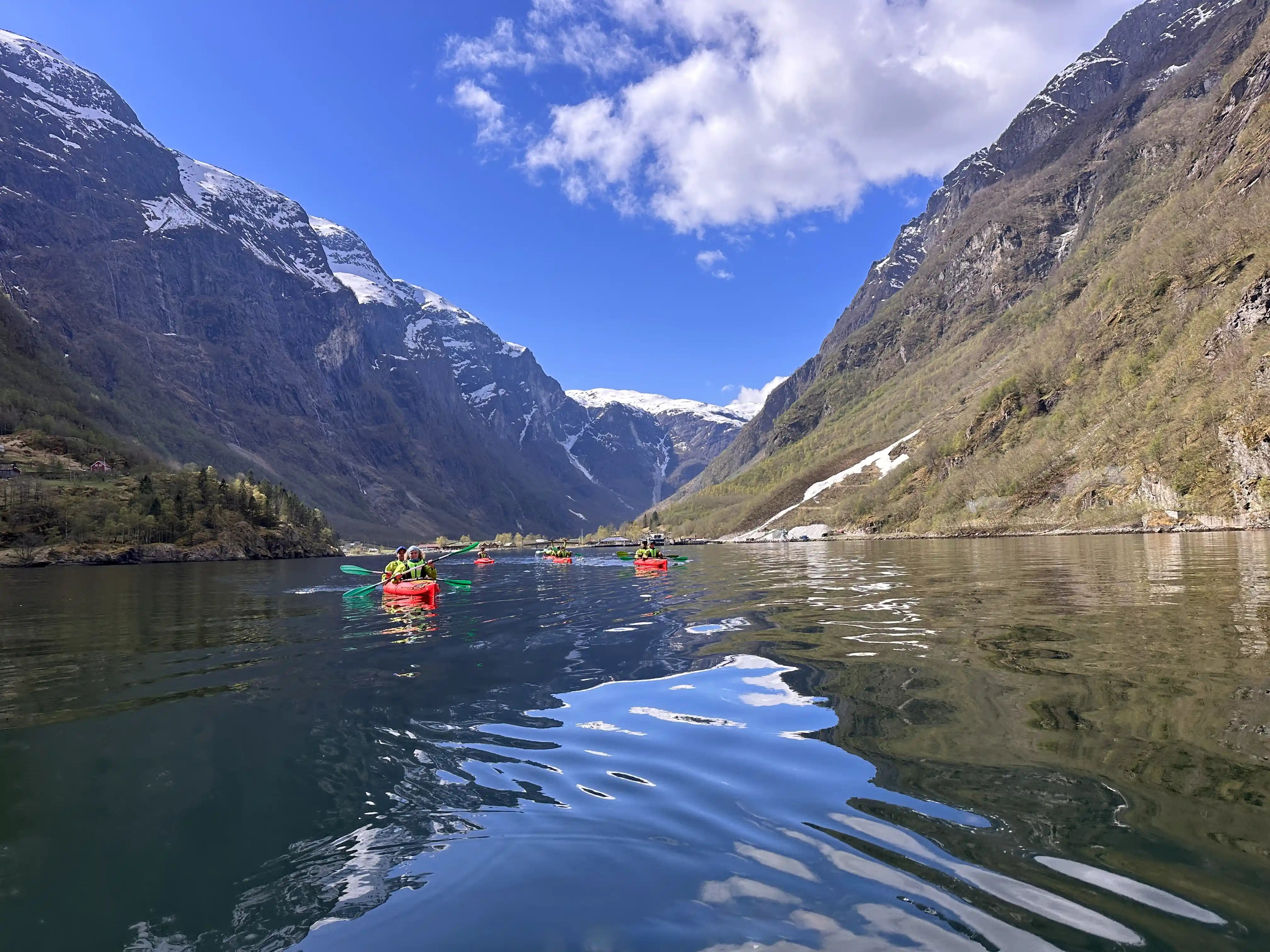 A group kayaking among the fjords of Naeroyfjord, Norway