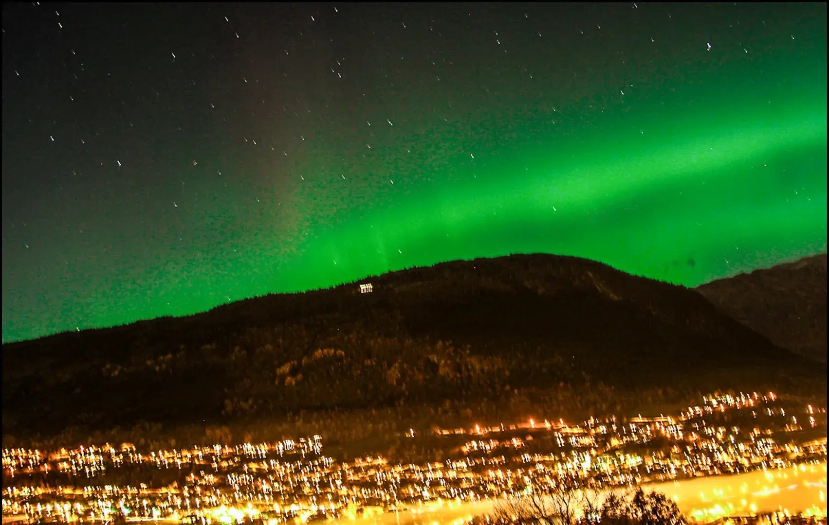 The Aurora Borealis taken from shaky cam in Tromso, by a local photographer