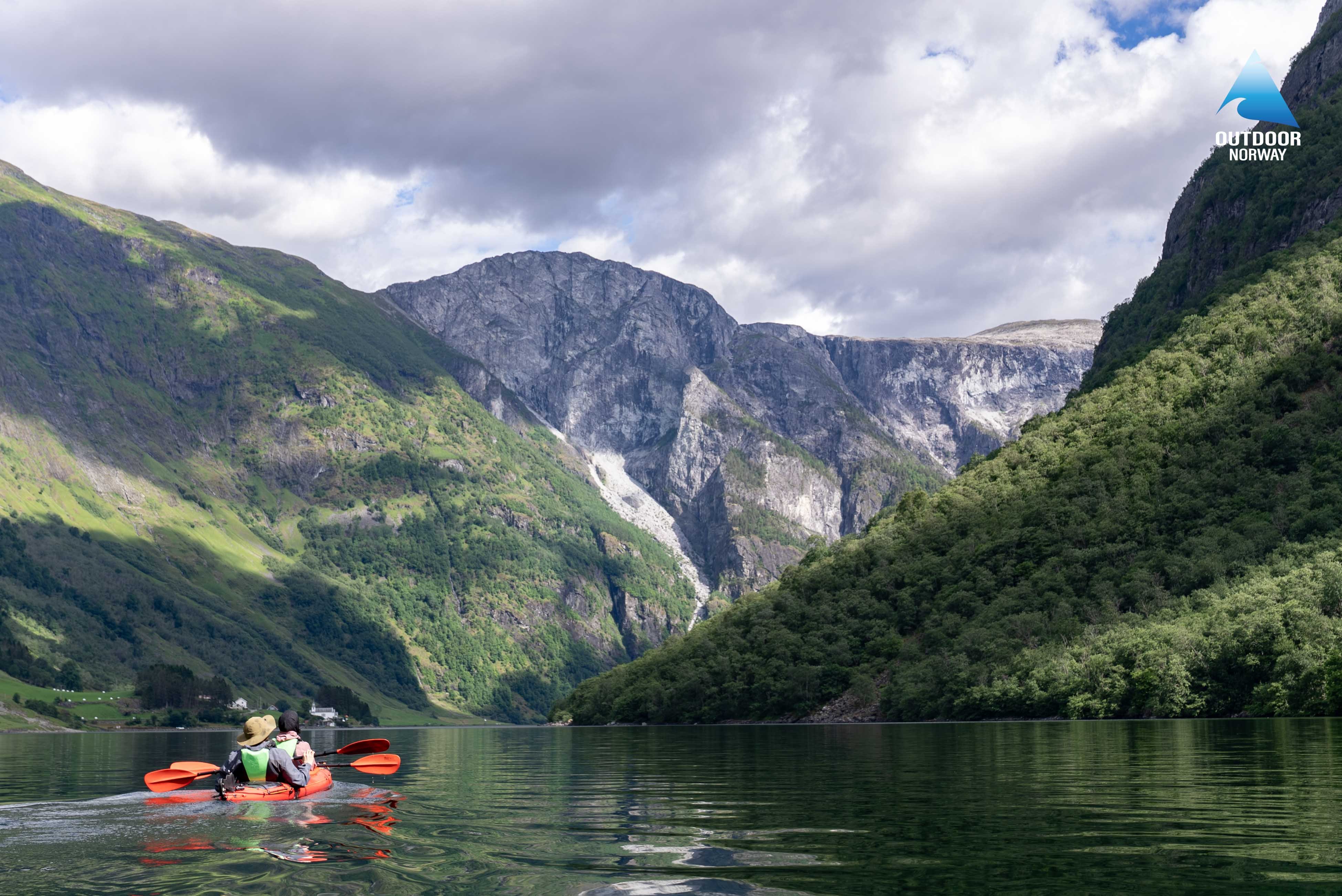 Two kayakers in a Norwegian fjord near Voss, Norway