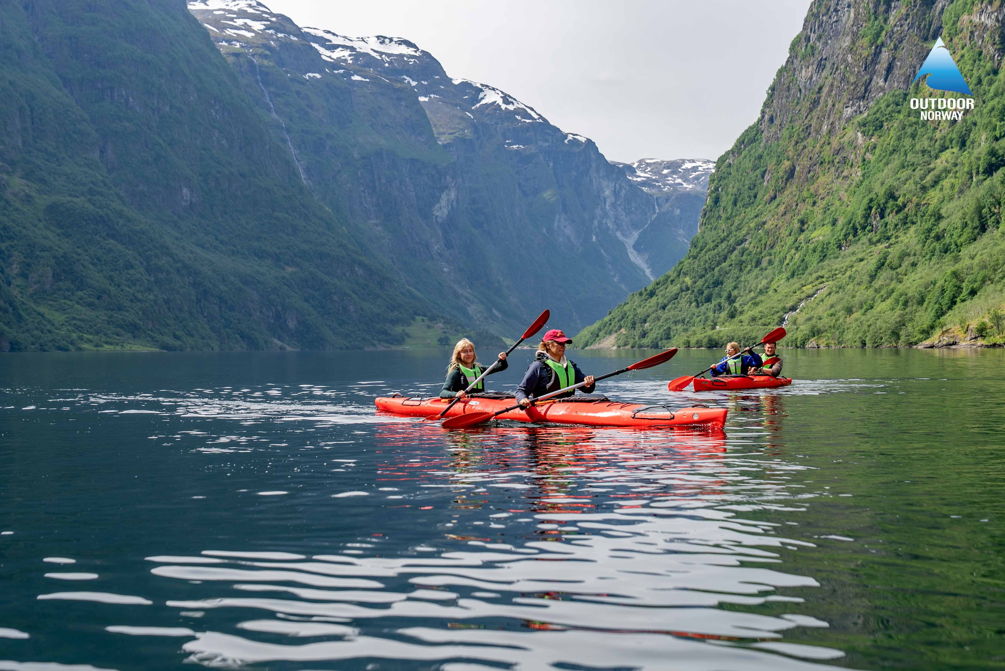 Group of women kayaking Naeroyfjord, Norway