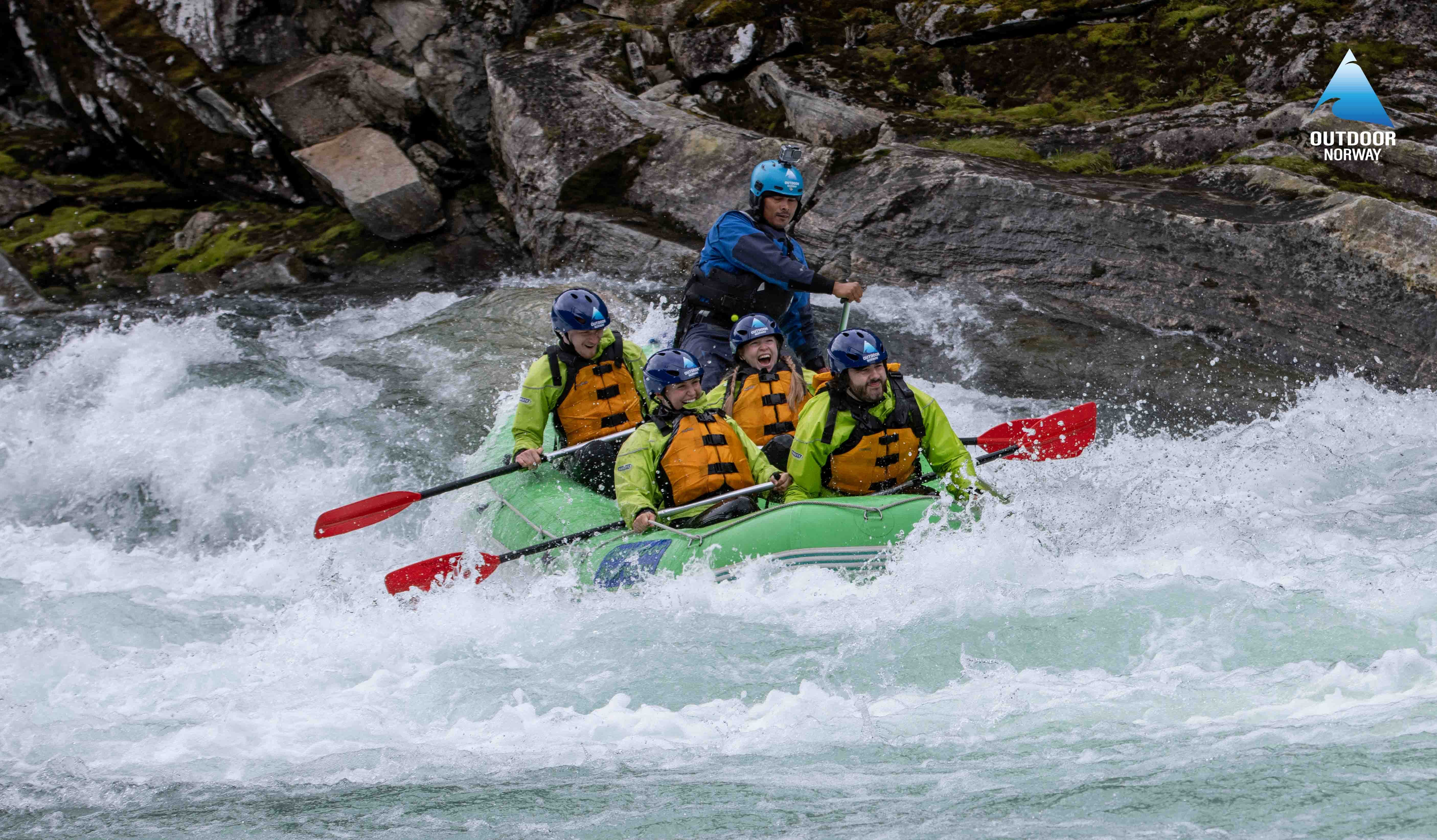 Group of adventurers rafting in Voss, Norway, an inexpensive activity on the Raundal River