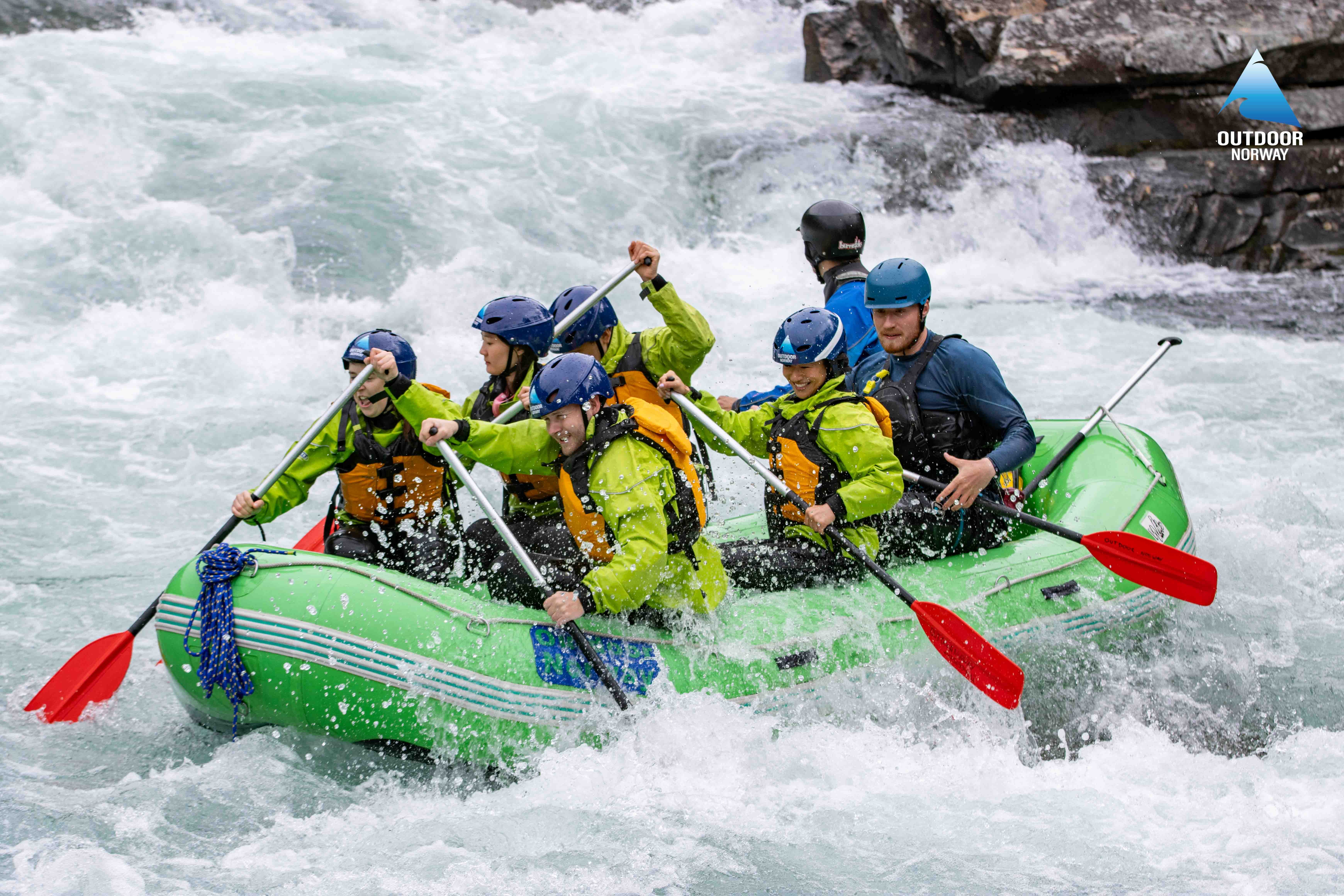 Group of tourists whitewater rafting in Voss, Norway