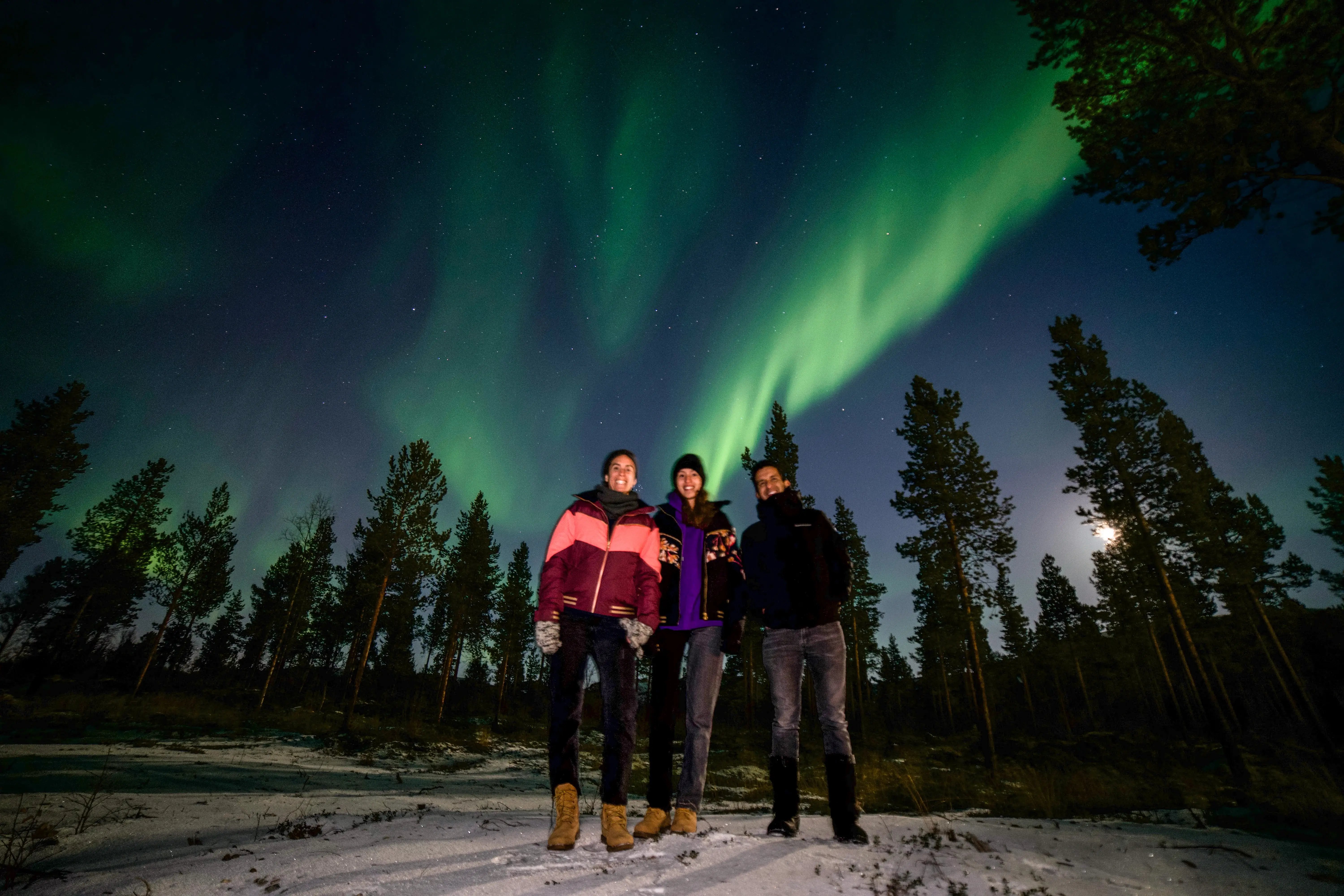 People taking a selfie on a guided Northern Lights tour with Outdoor Norway