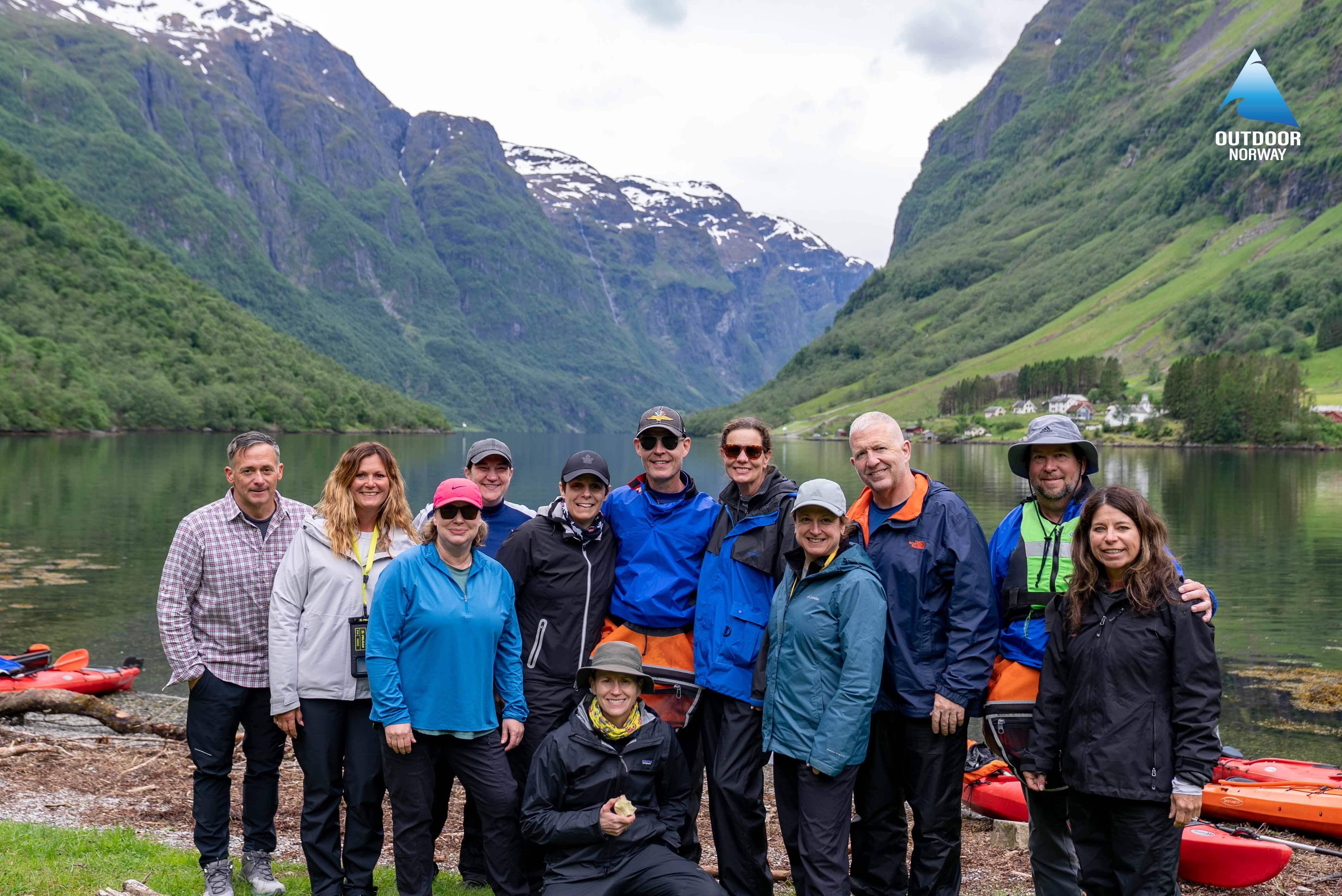 An Outdoor Norway kayak group with tourists and a local guide after a Naeroyfjord kayak tour