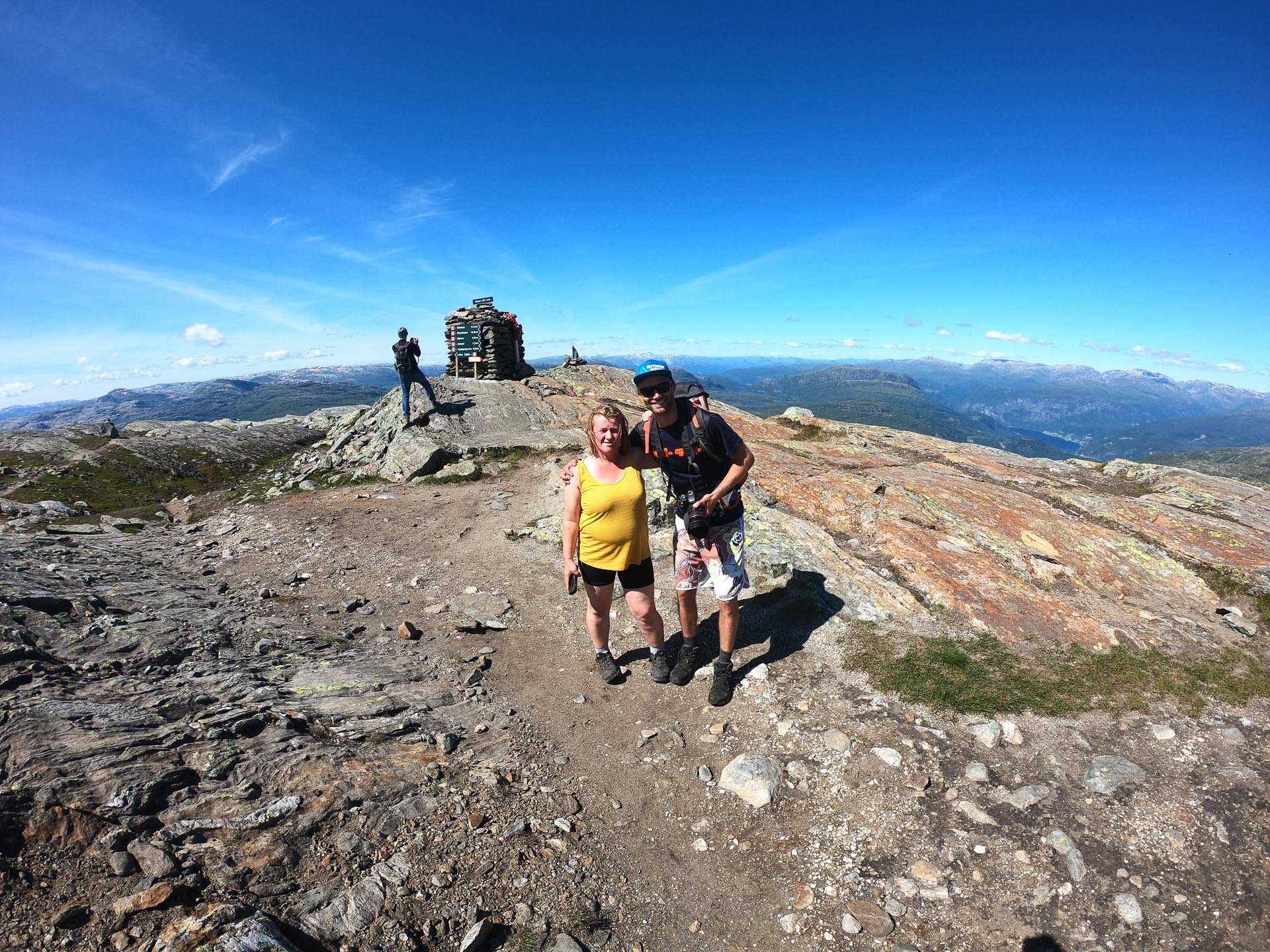 Two hikers happy after a successful sunny hiking tour near Hardangerfjord, Voss, Norway