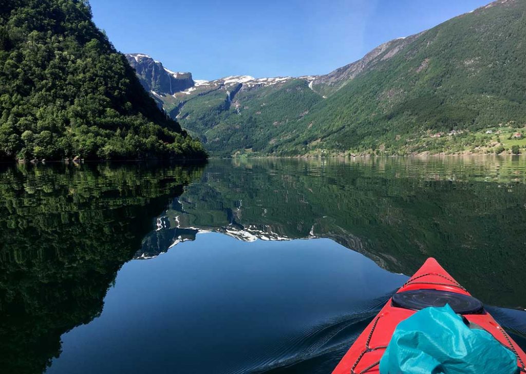 calm fjord with kayak