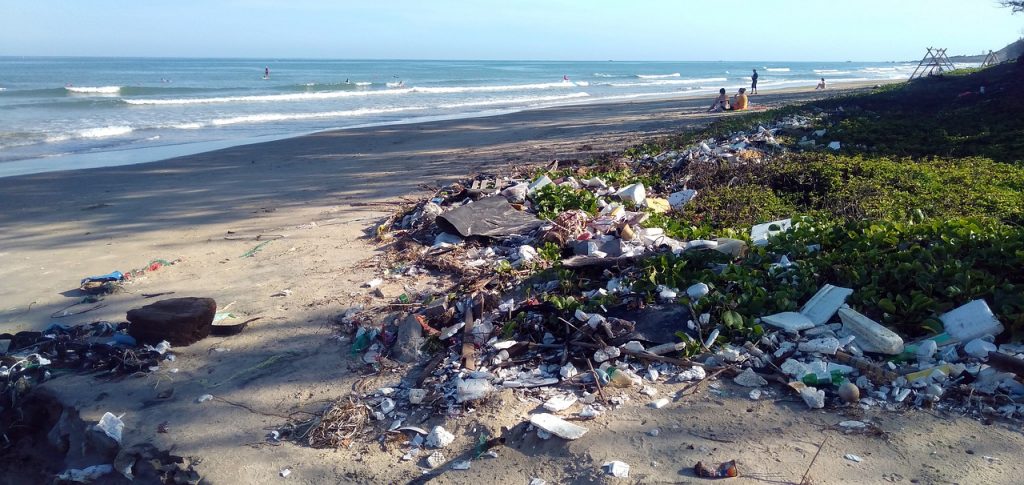 pollution on a beach after tourists visits