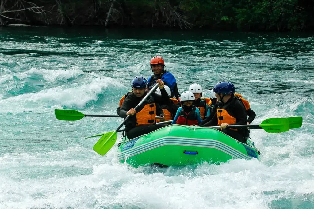 Family rafting on a clear turquoise river adventure and fun