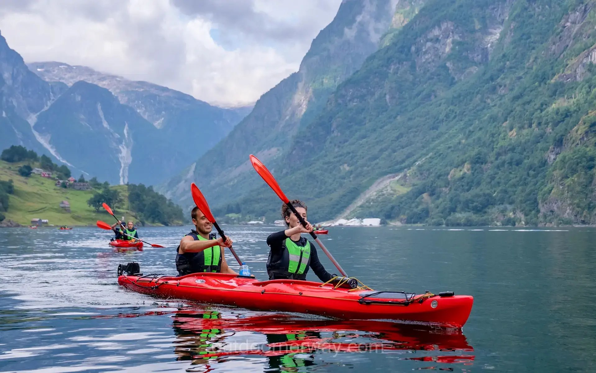 Kayakers exploring Hardangerfjord on a guided Outdoor Norway tour