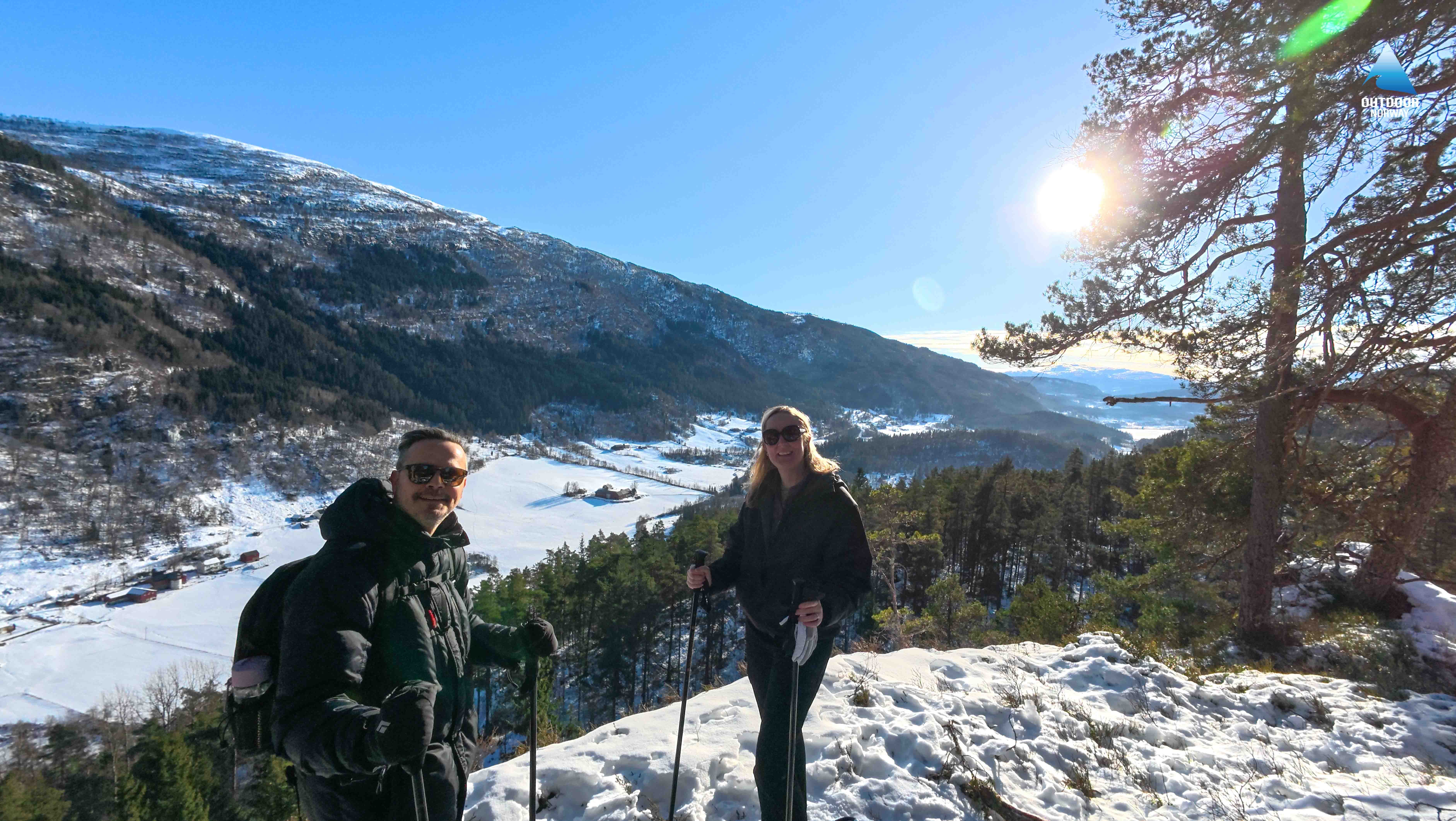 Explorers snowshoeing near Tvindefossen waterfall
