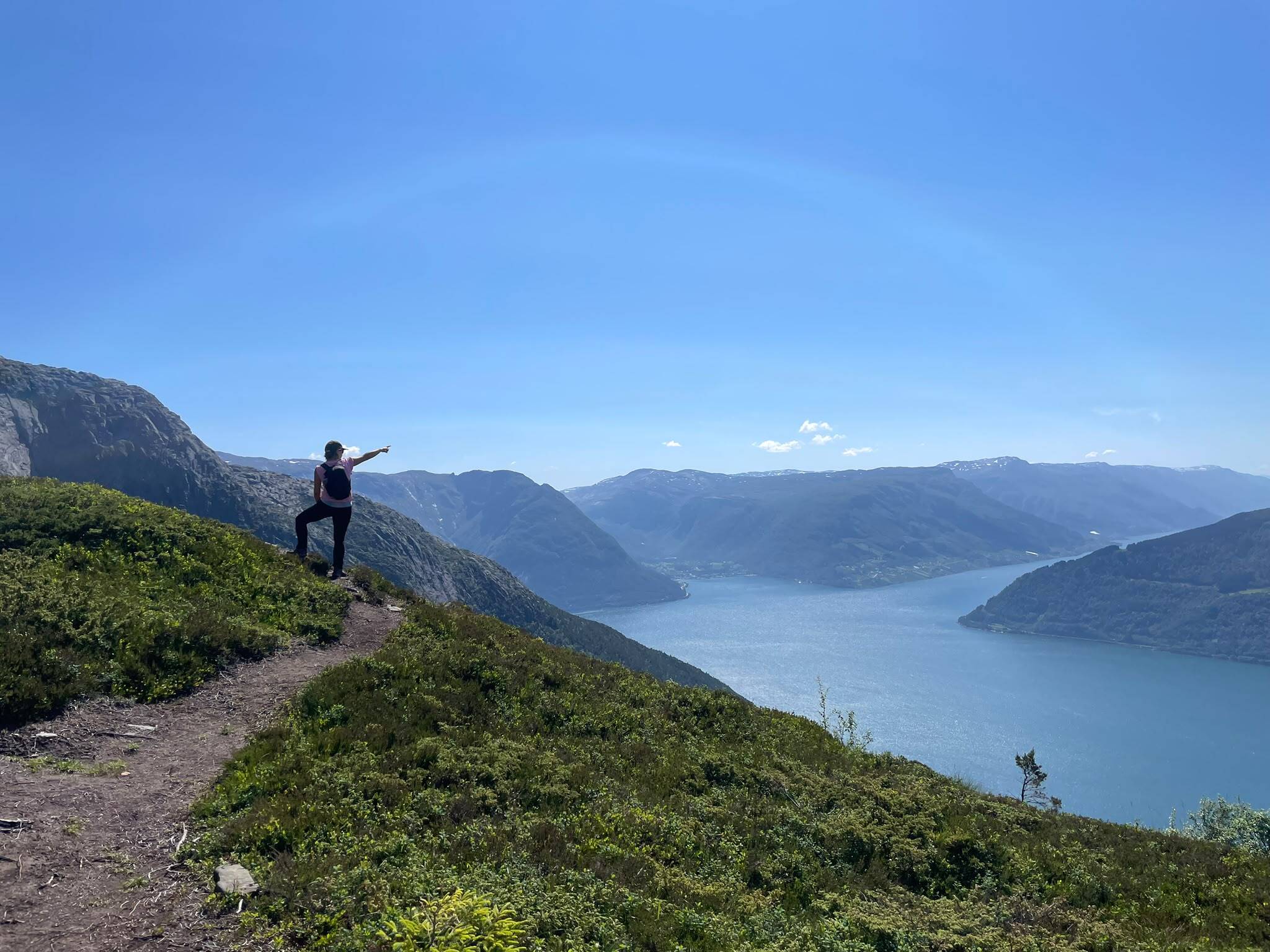 Hiker admiring the fjords near Voss, Norway