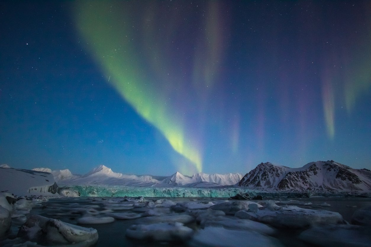 The Aurorra Borealis shining high above Svalbard, Norway, one of the best places to see them at
