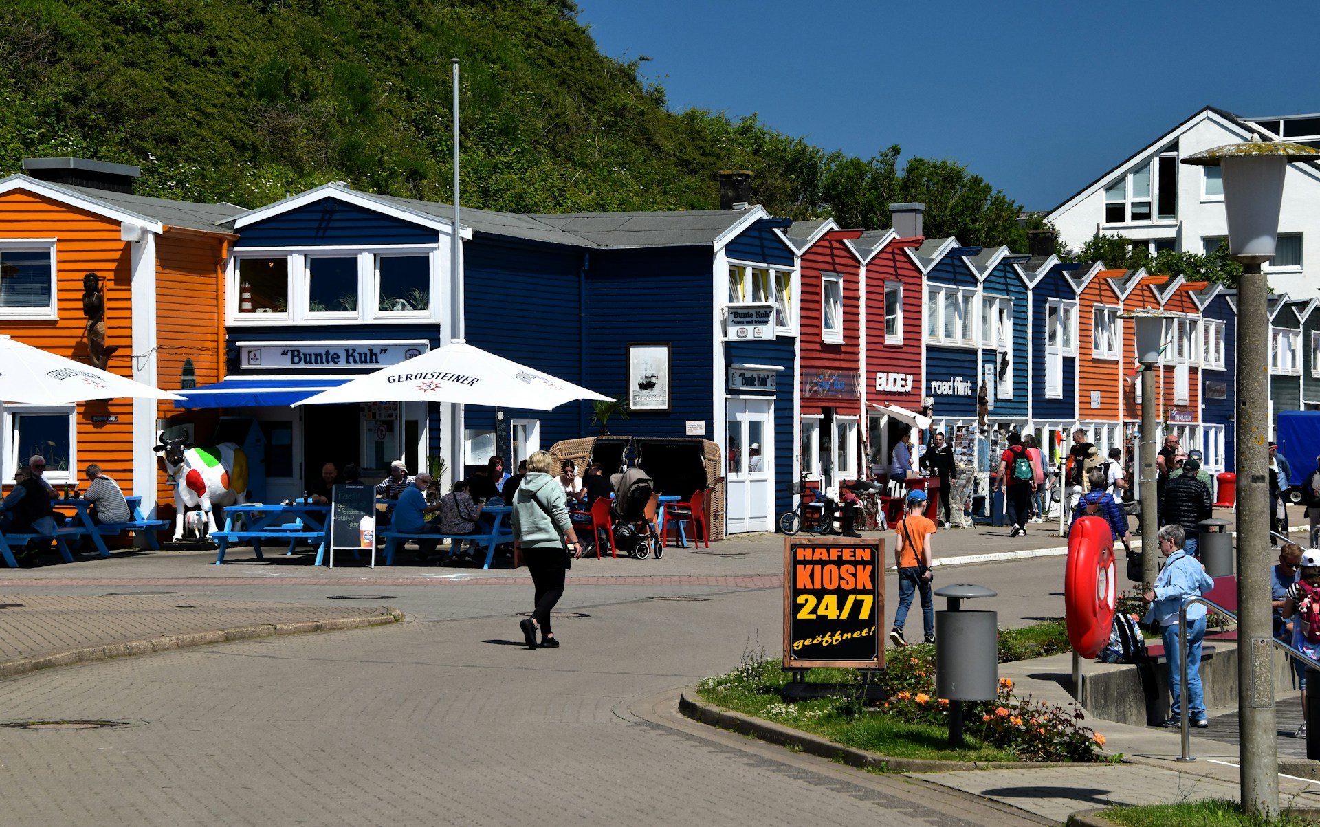 Tourists walking around Bergen in the summer sun