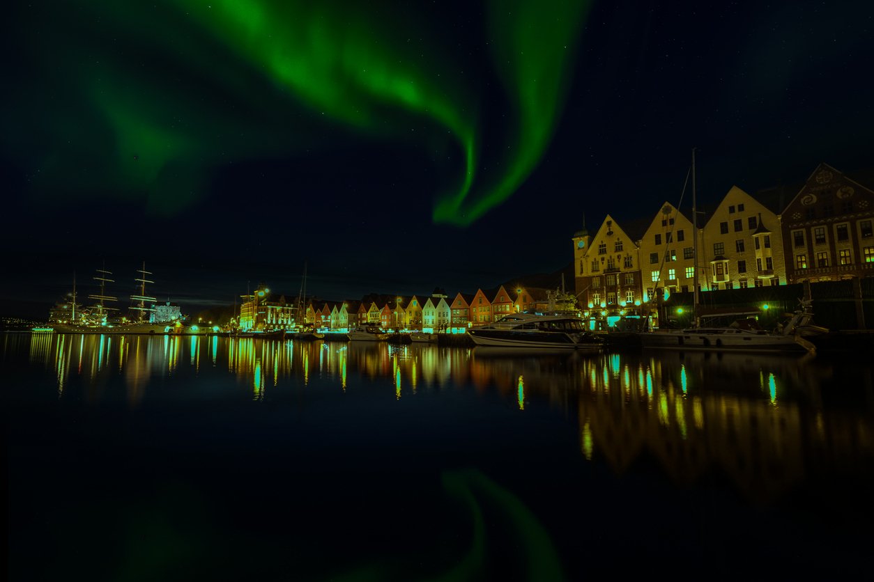 Northern Lights shining above Bryggen in Bergen, Norway in the wintertime