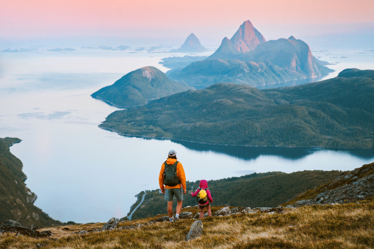 A father and daughter hiking above Helgeland, Norway
