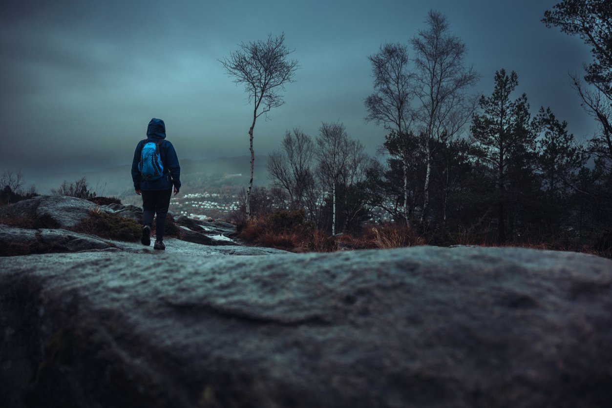 A hiker on the Lovstakken trail at night