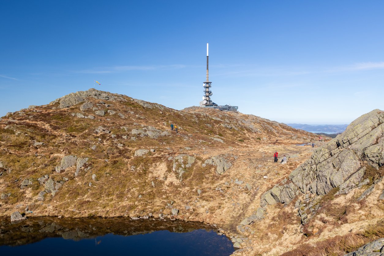 Hikers on top of Mount Ulriken in Bergen, Norway