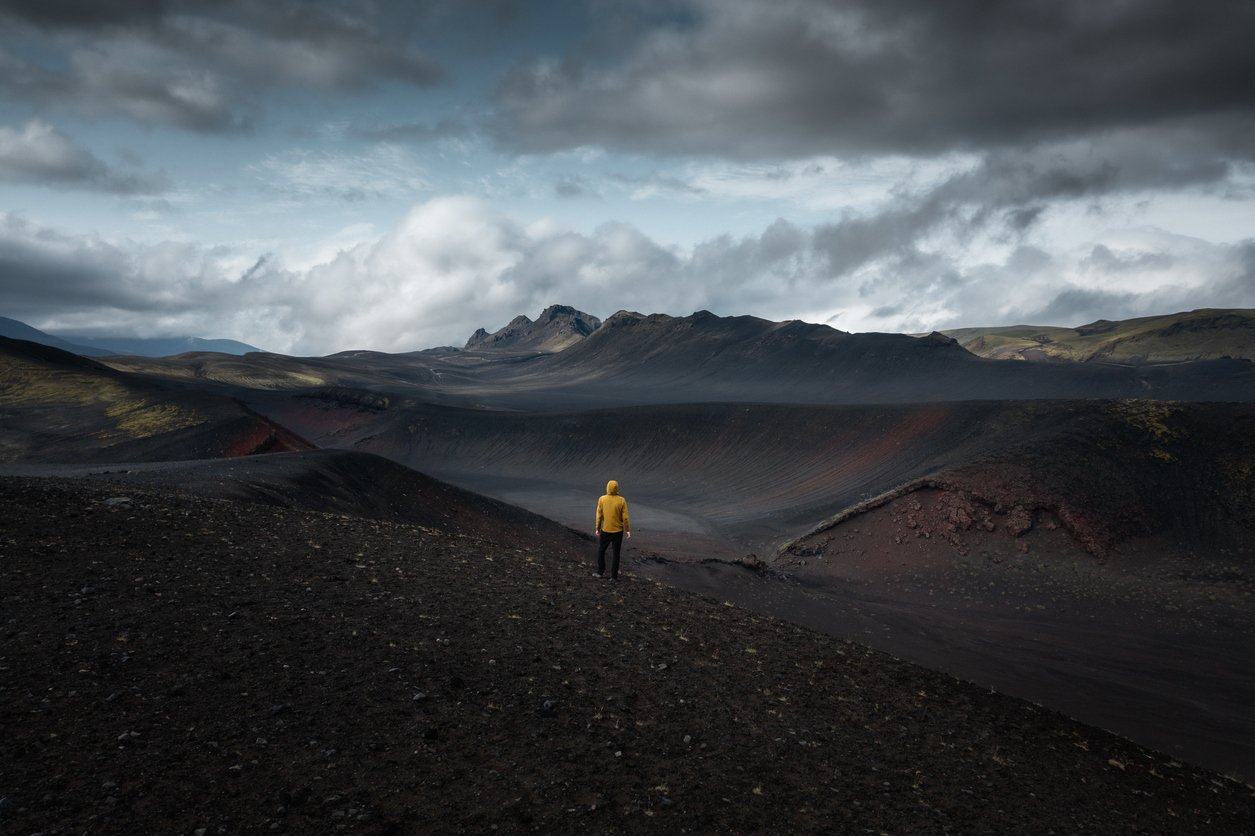 A man hiking in the Black Desert of Iceland