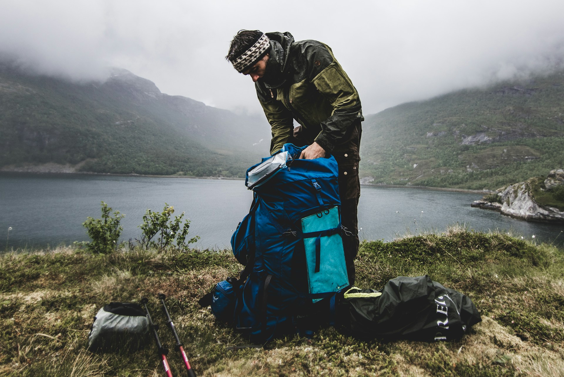 Man packing for hiking one of the best multi-day hikes in Nroway, AUrlandalen