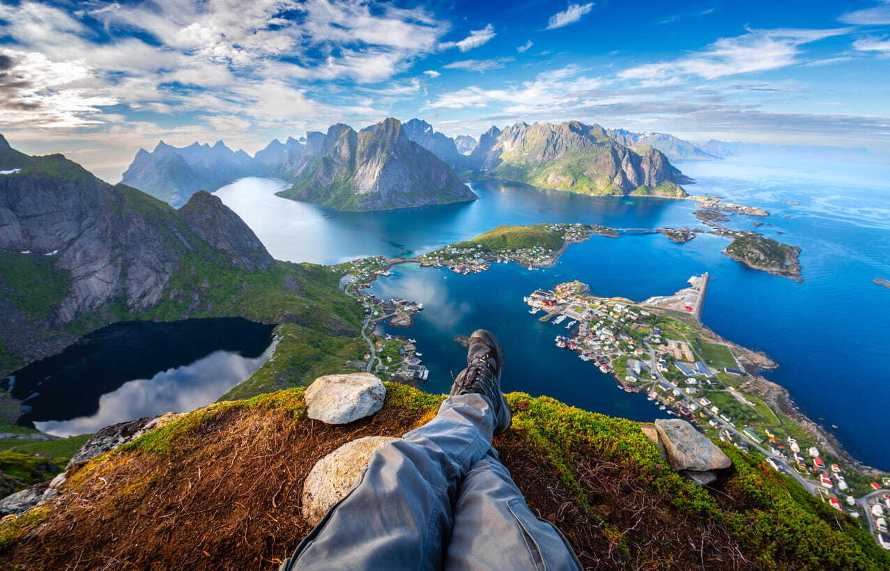 A man relaxing on a hill in Lofoten, Norway