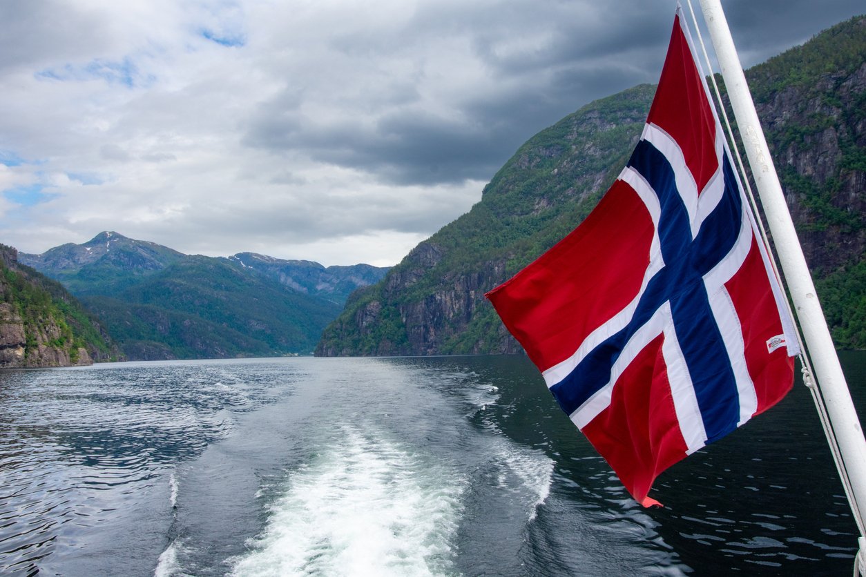 A flag on the back of a cruise ship going through osterfjord & Mostraumen on a day trip from Bergen