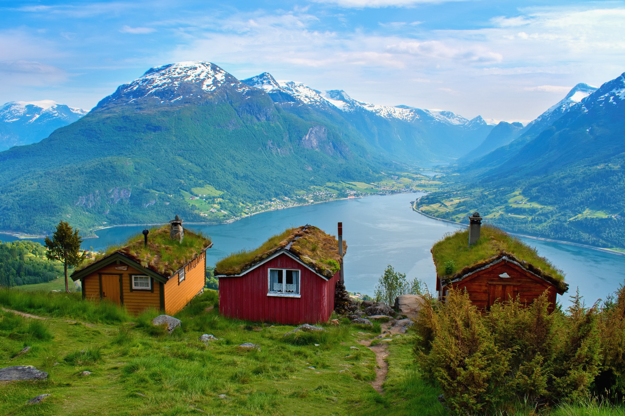 A view of the Raksettra hiking area and beautiful traditional houses in Loen, Norway