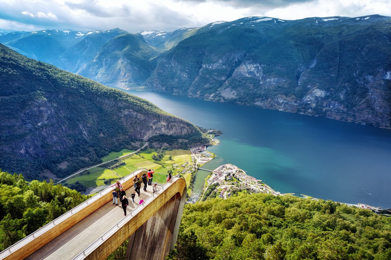 Tourists admiring the view from the Stegastein viewpoint in Voss, Norway