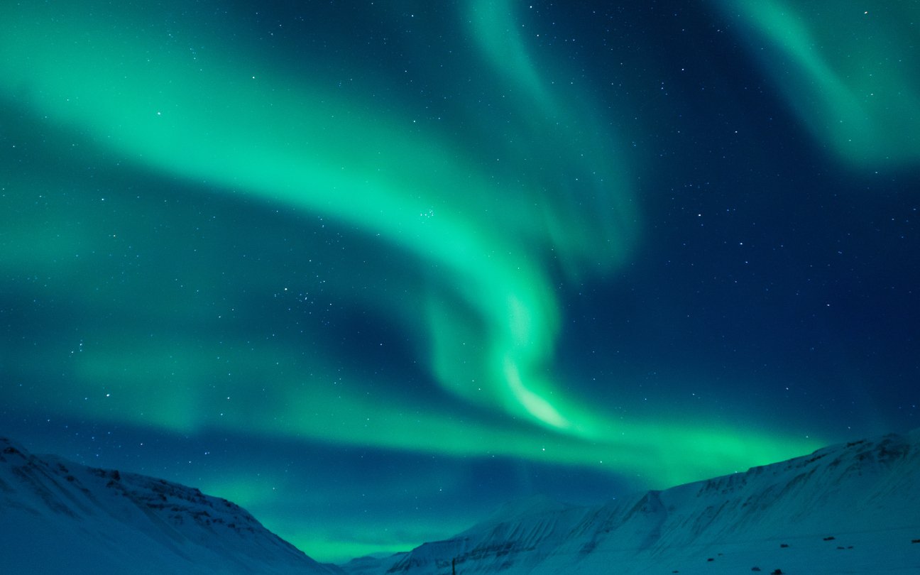 Northern Lights dancing above the plains of Svalbard, Norway