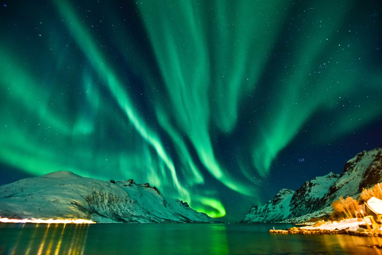 The Aurora Borealis above the northern wilderness of Tromsø, Norway