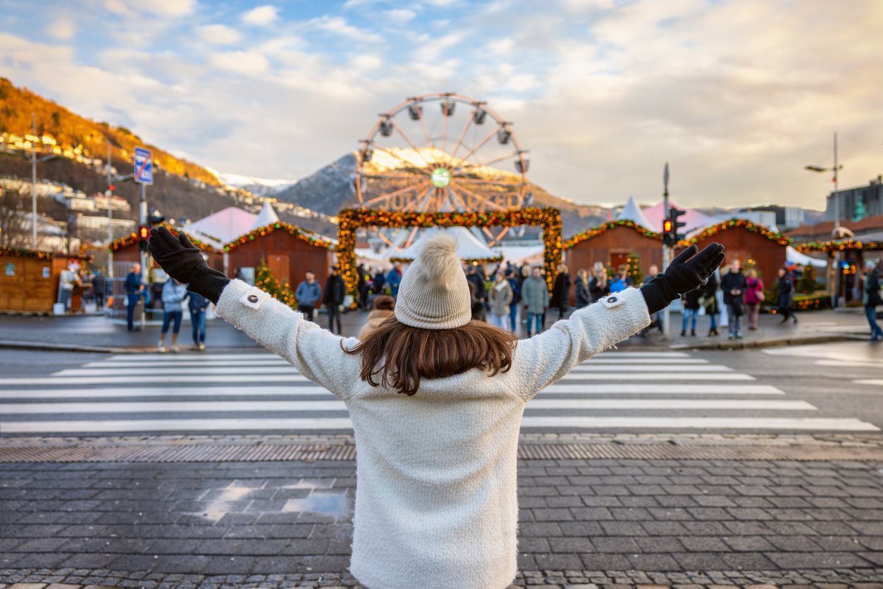 A woman admiring the Bergen christmas market in Norway