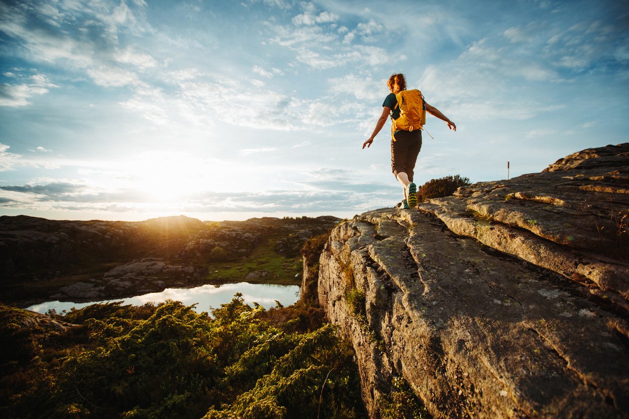 A woman hiking in the Bergen area on a plateau